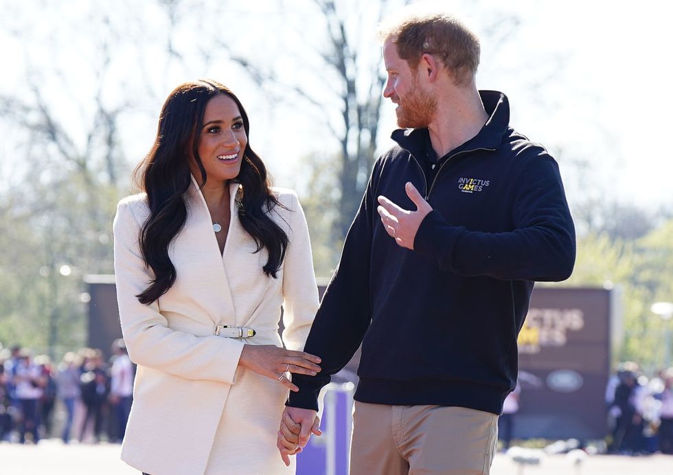 The Duke and Duchess of Sussex attending the Invictus Games athletics events in the Athletics Park, at Zuiderpark the Hague, Netherlands.
