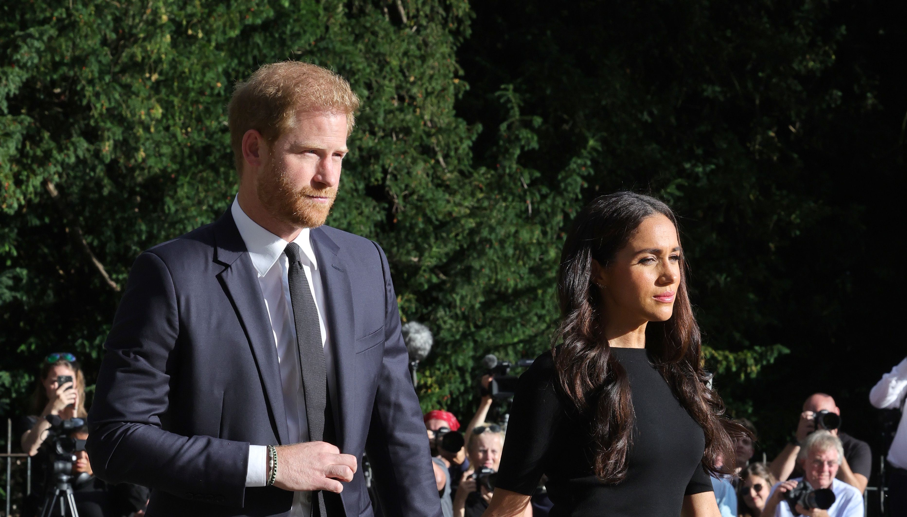 The Duke and Duchess of Sussex walk to meet members of the public at Windsor Castle in Berkshire following the death of Queen Elizabeth II on Thursday. Picture date: Saturday September 10, 2022.