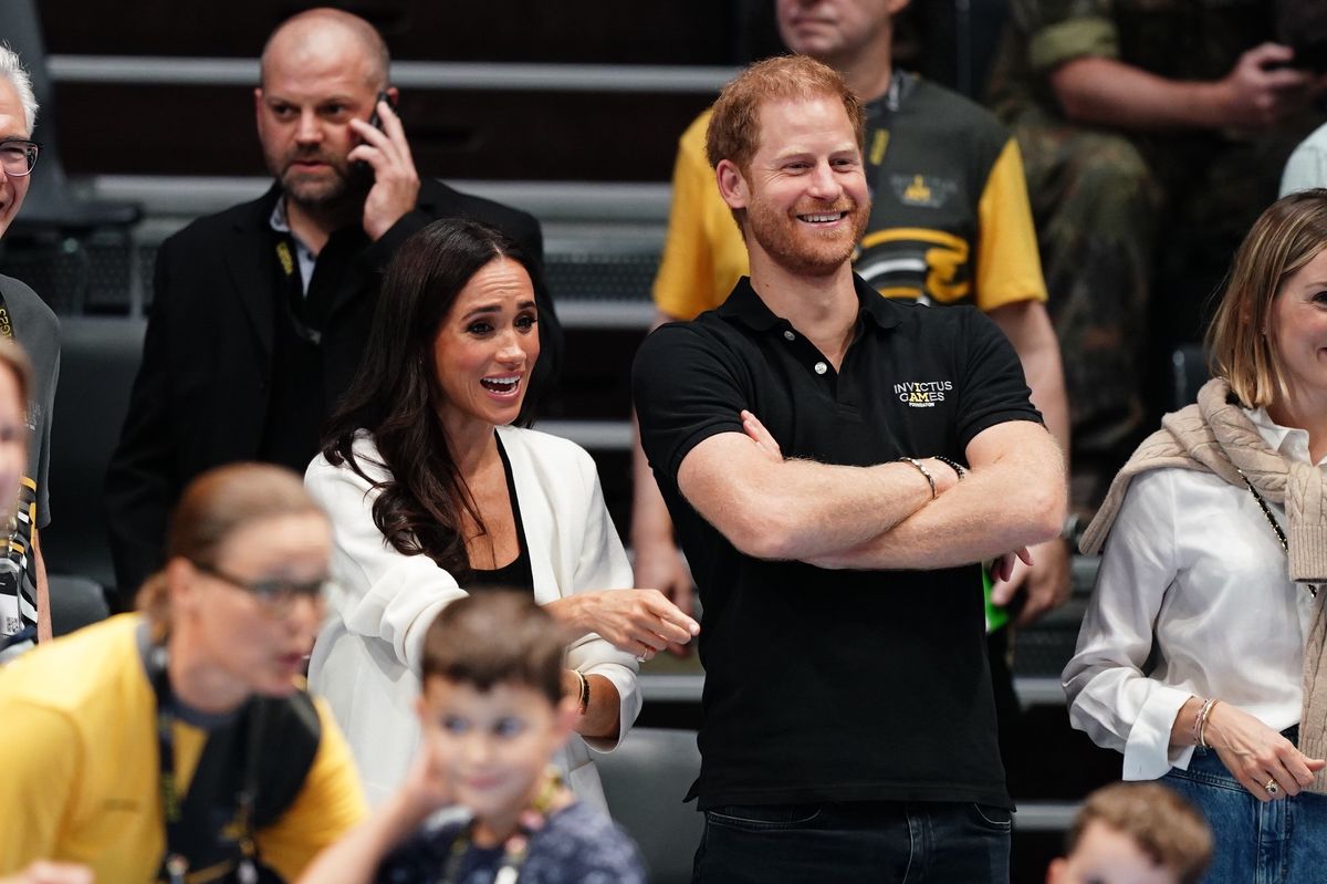 The Duke and Duchess of Sussex watching children on the basketball court at the Merkur Spiel-Arena during the Invictus Games in Dusseldorf, Germany