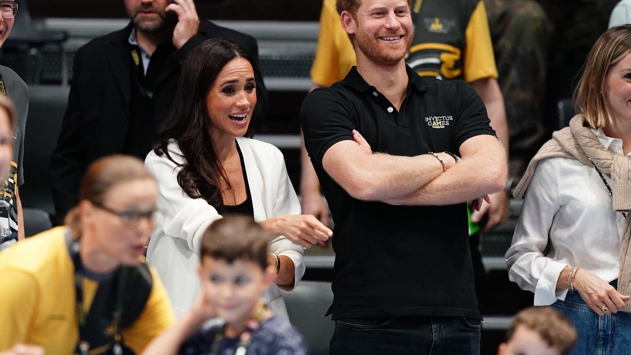 The Duke and Duchess of Sussex watching children on the basketball court at the Merkur Spiel-Arena during the Invictus Games in Dusseldorf, Germany