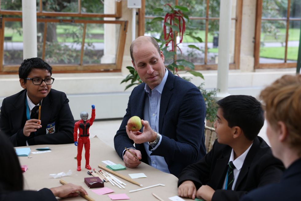 The Duke Cambridge with children from The Heathlands School during a visit to the Royal Botanic Gardens, Kew, in south London