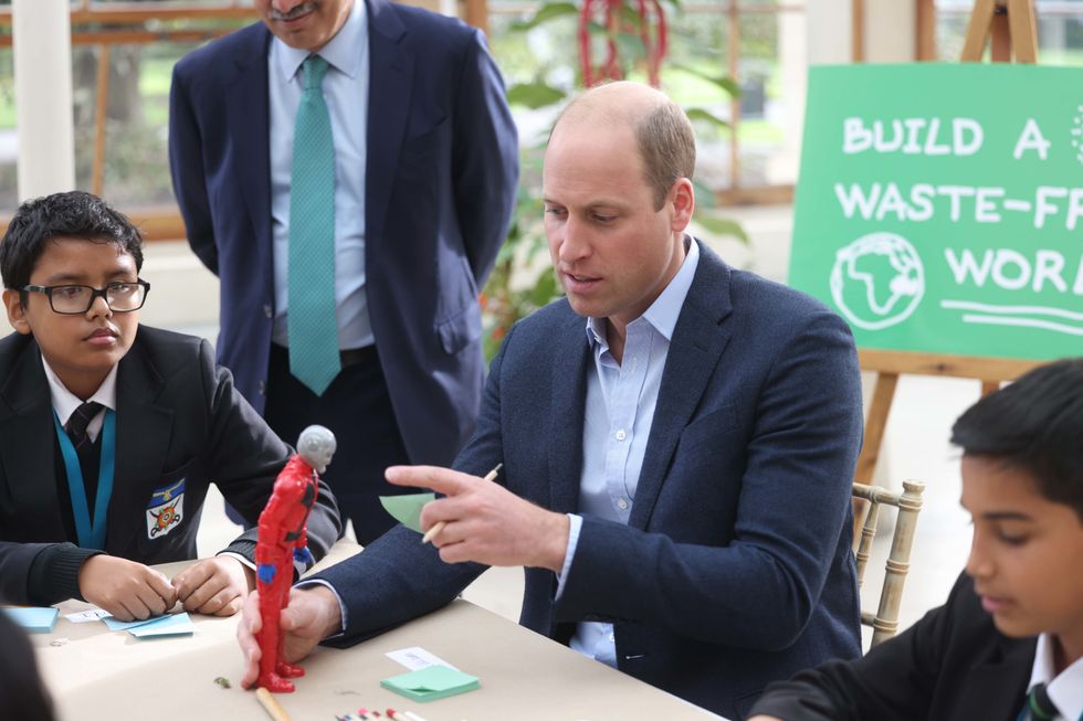 The Duke Cambridge with children from The Heathlands School during a visit to the Royal Botanic Gardens, Kew.