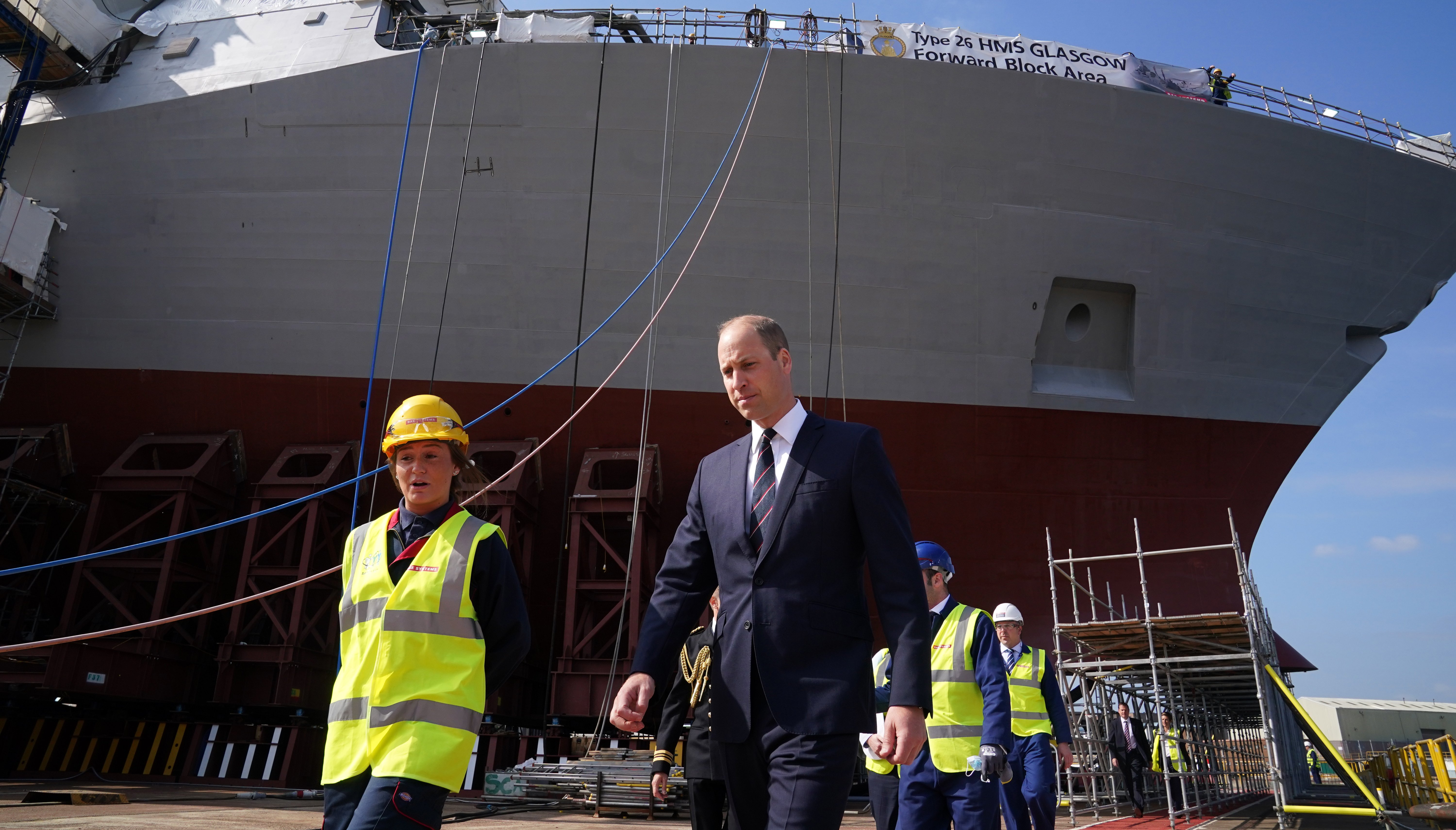 The Duke of Cambridge, known as the Earl of Strathearn in Scotland, alongside apprentice Cara Shannon as they view construction work on HMS Glasgow.