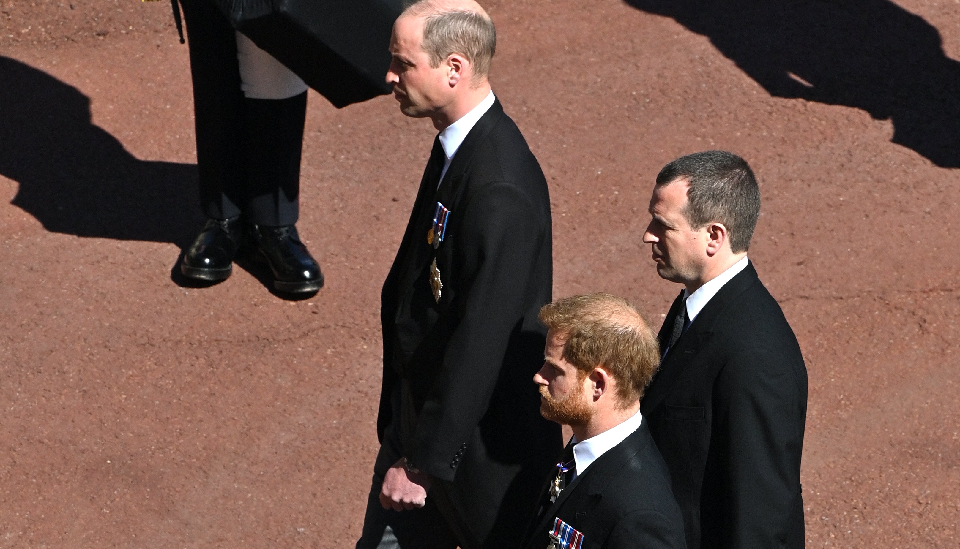 The Duke of Cambridge, the Duke of Sussex and Peter Phillips outside St George's Chapel, Windsor Castle, Berkshire, during the funeral of the Duke of Edinburgh.