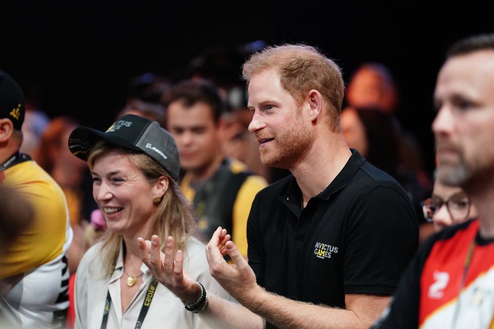 The Duke of Sussex meets athletes and veterans during a walkabout in the stadium during the Invictus Games at the Merkur Spiel-Arena in Dusseldorf, Germany
