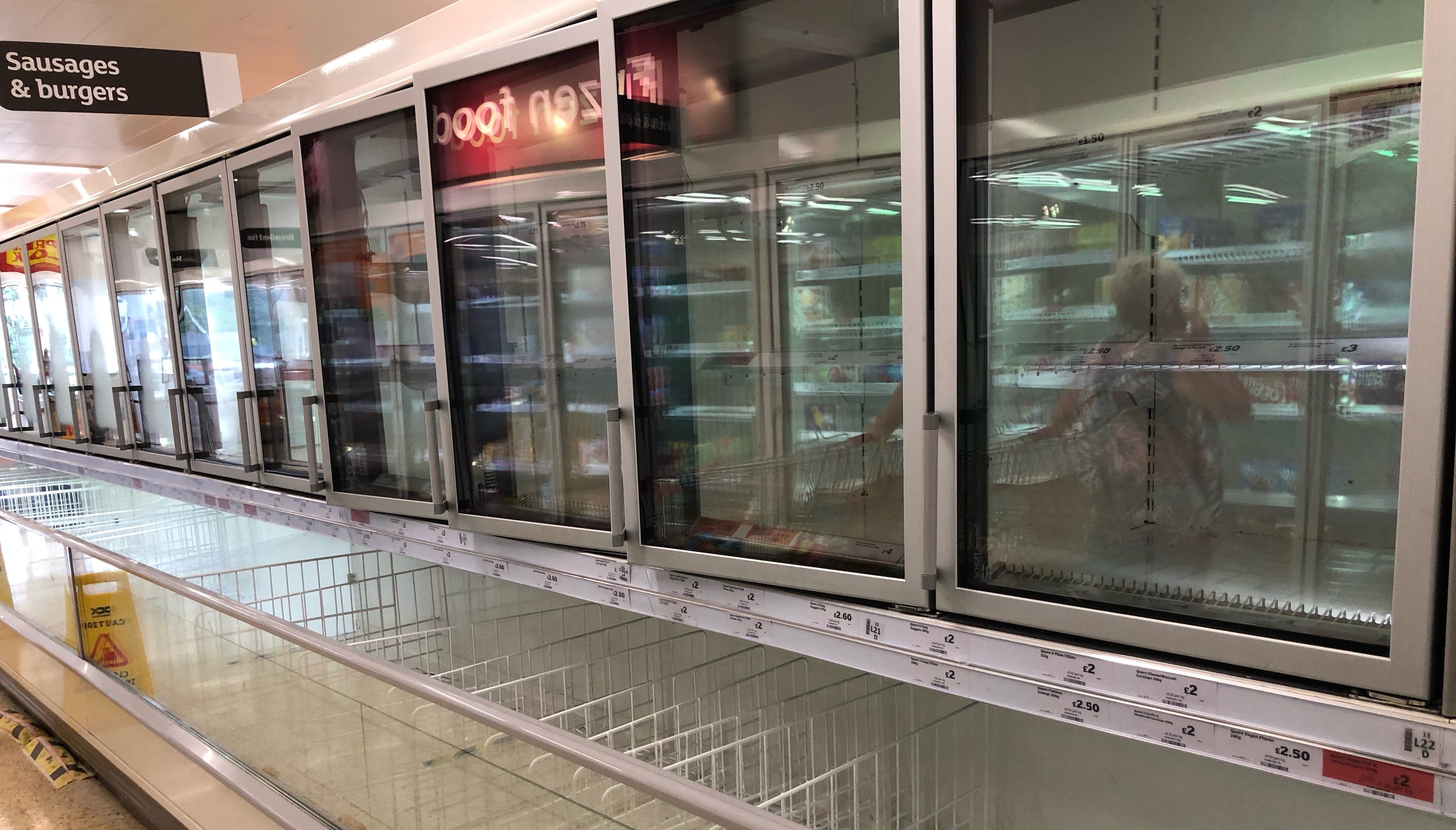 The empty sausage and burger section of the freezer aisle at the Sainsbury supermarket at the Arnison Centre, Durham. Supermarkets have urged customers not to panic buy in response to reports of emptying shelves, saying they are continuing to receive regular deliveries.