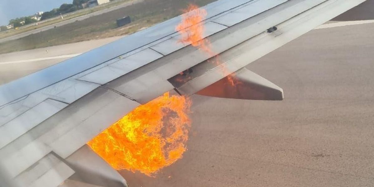 NextImg:Ryanair plane's wing explodes into fireball as passengers urgently evacuate down emergency slides