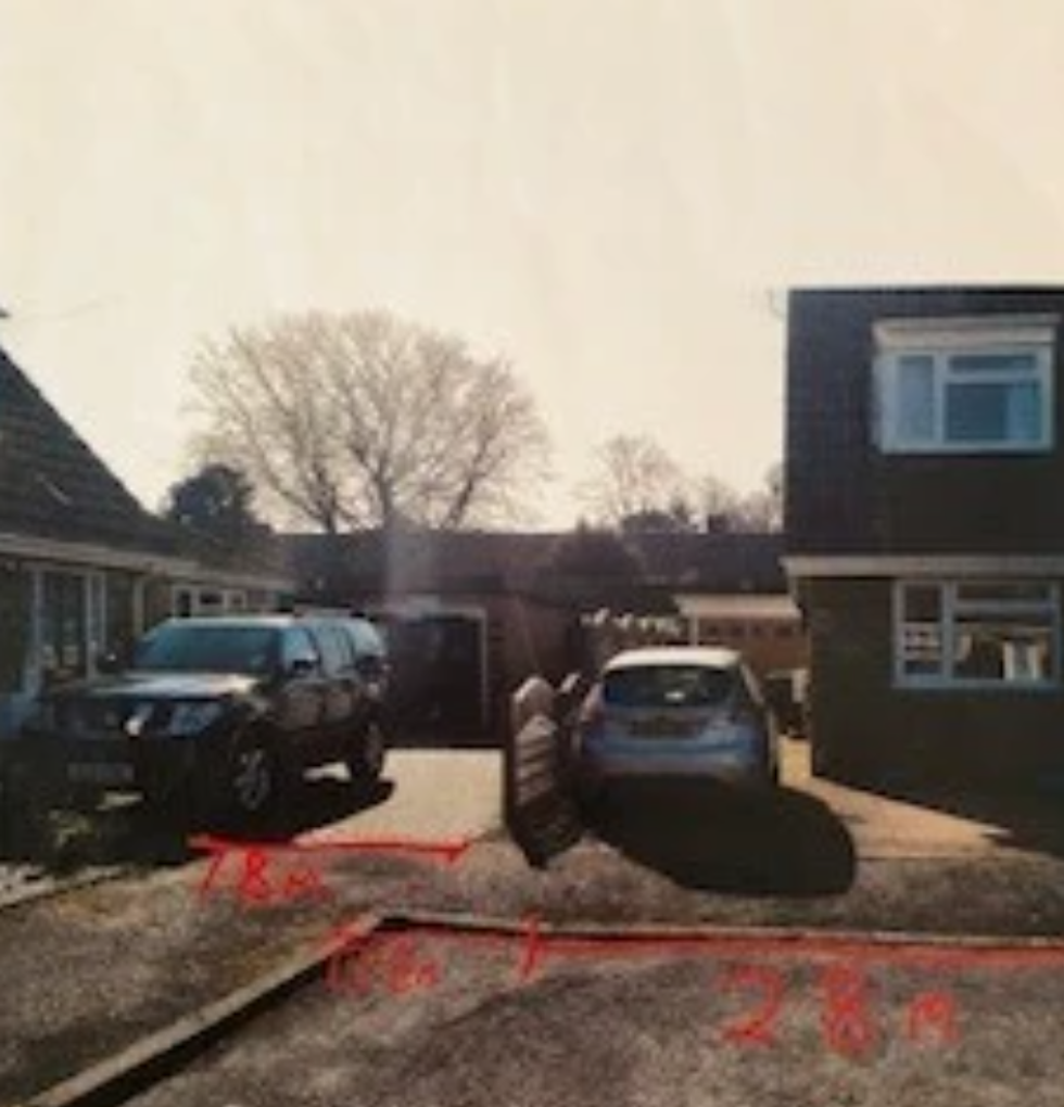 The erected fence that the couple have argued blocked their drive