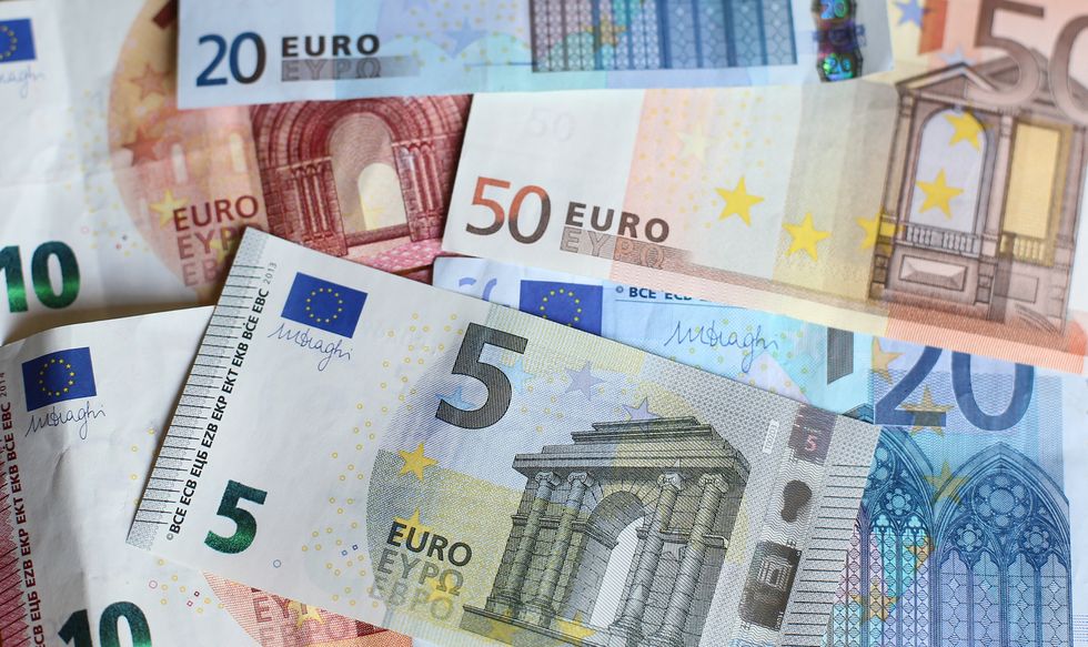 The euro fell below $1.00 for the first time since December 2002