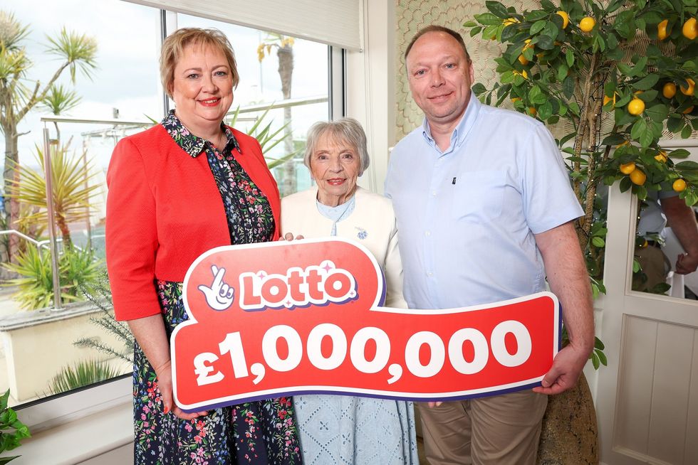 The family holding a national lottery sign