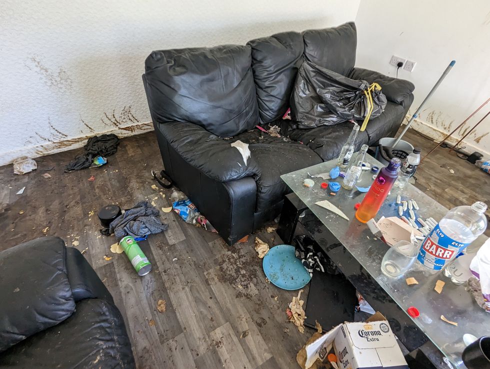 The filthy flat covered in rubbish