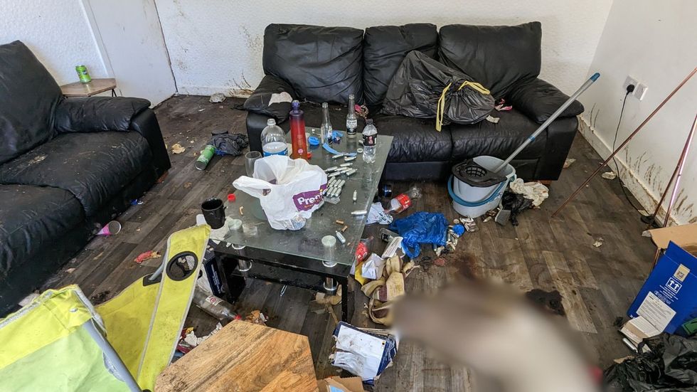 The filthy flat covered in rubbish