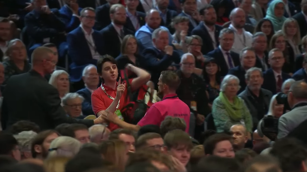 The finger-wagging protester was removed from the ACC