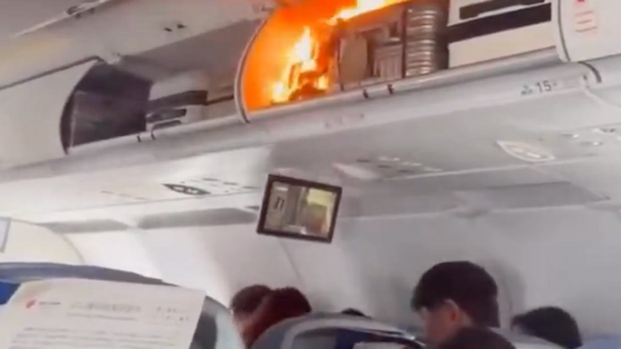 The fire took place in the overhead luggage compartment