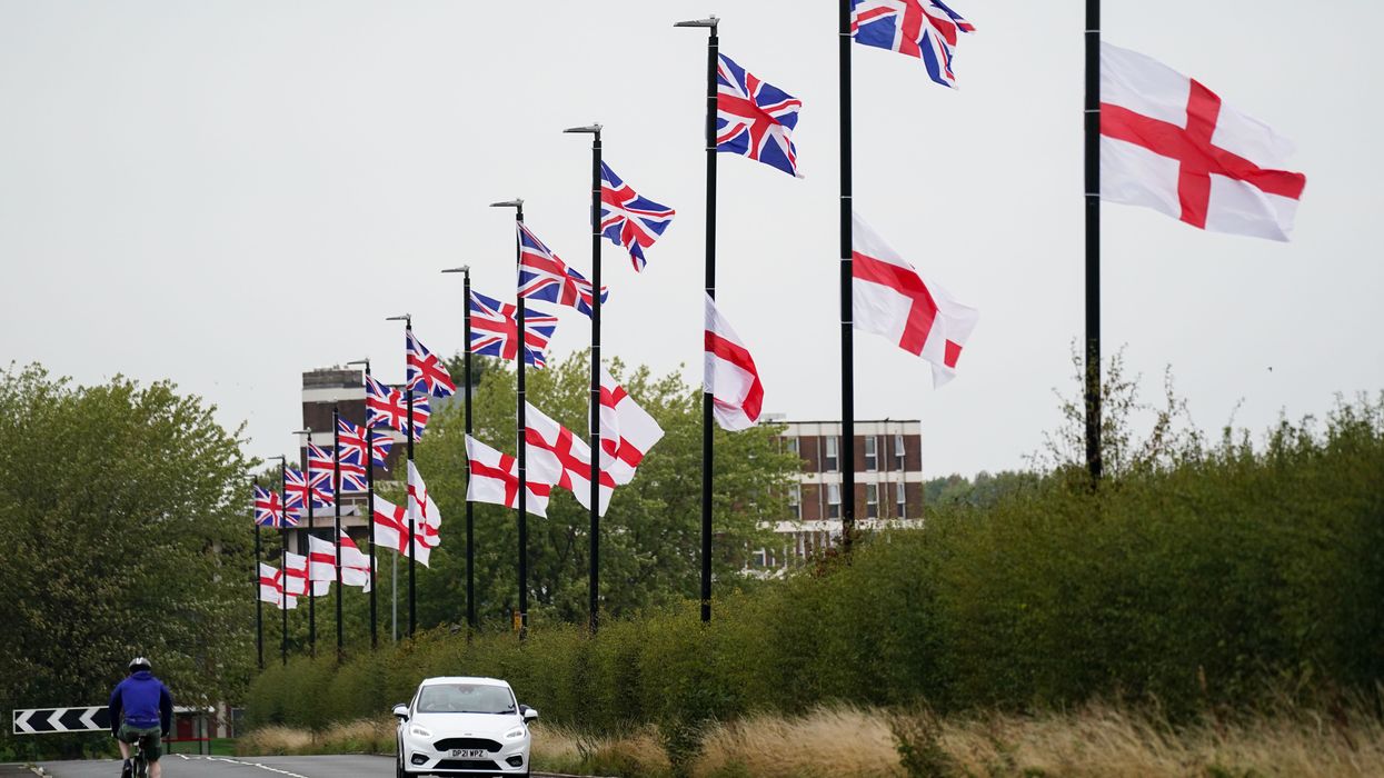 The flag of the United Kingdom and the Flag of St George hang from lamposts in Birmingham