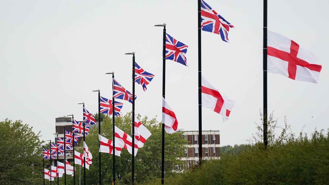 The flag of the United Kingdom and the Flag of St George hang from lamposts in Birmingham