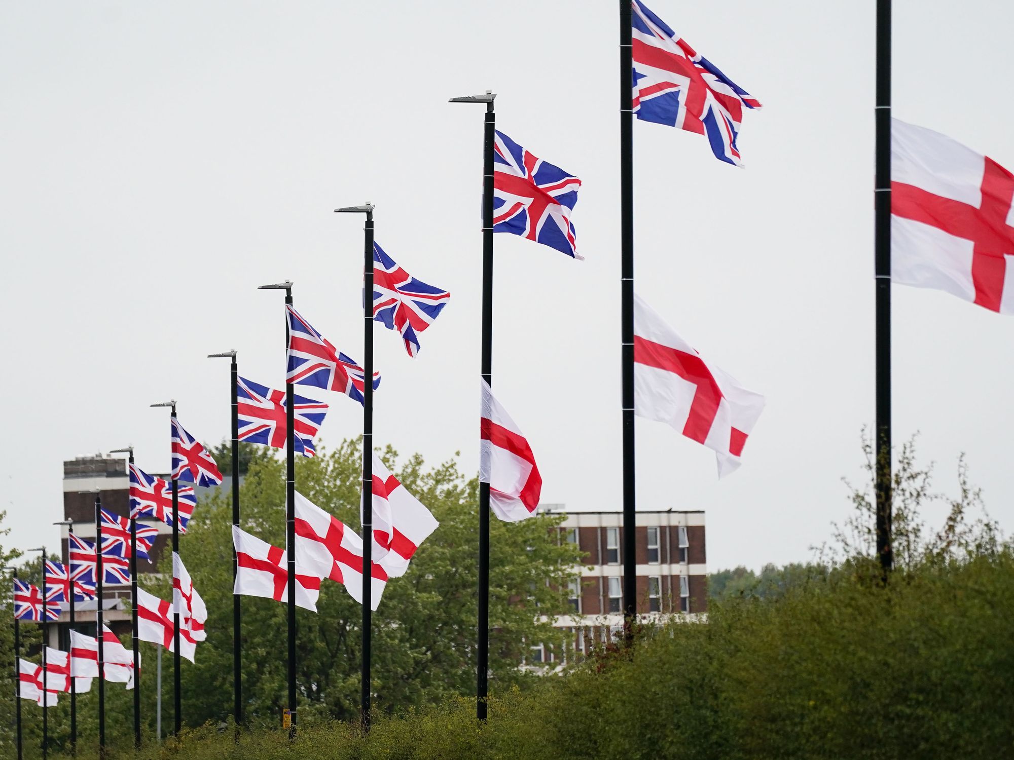 The flag of the United Kingdom and the Flag of St George hang from lamposts in Birmingham