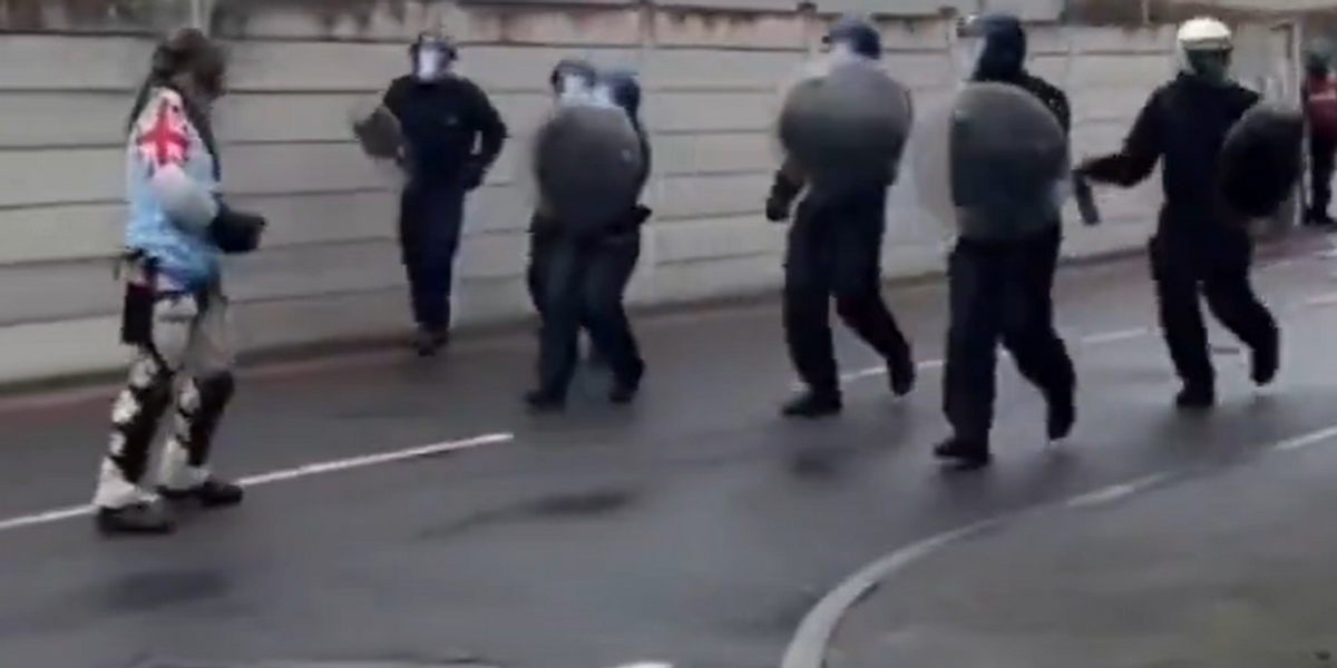 'Rioter' wearing Union Jack on his arm used as part of riot police ...