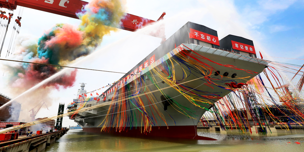 NextImg:China puts on major show of force by sending hulking new aircraft carrier through South China Sea