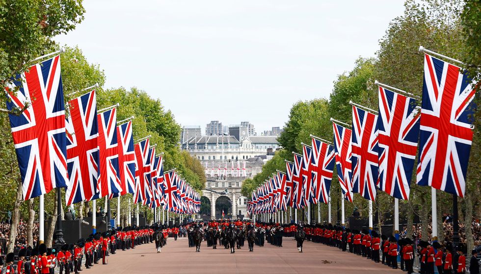 The funeral procession marches down The Mall following the service at Westminster Abbey, on the day of the state funeral and burial of Britain's Queen Elizabeth, in London, Britain, September 19, 2022 REUTERS/Andrew Boyers