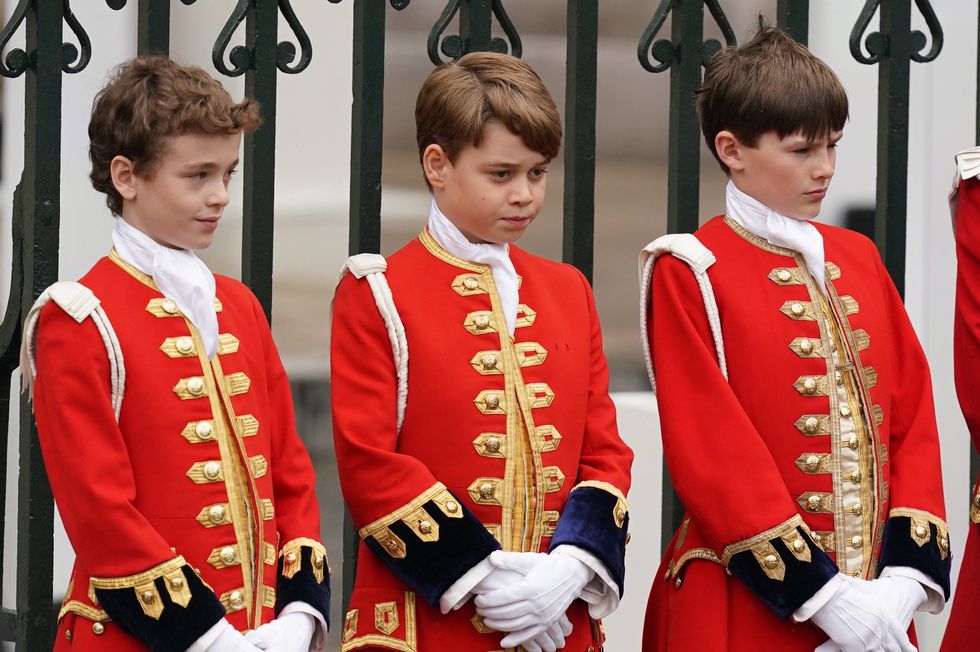 The future King carried a corner of his grandfather's trailing robes as the royal party walked into Westminster Abbey
