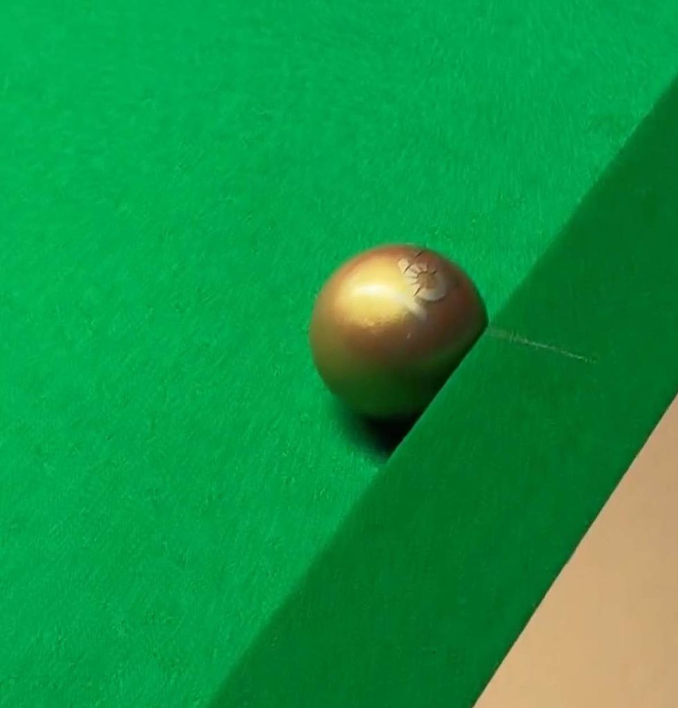 The golden ball has '167' emblazoned on it