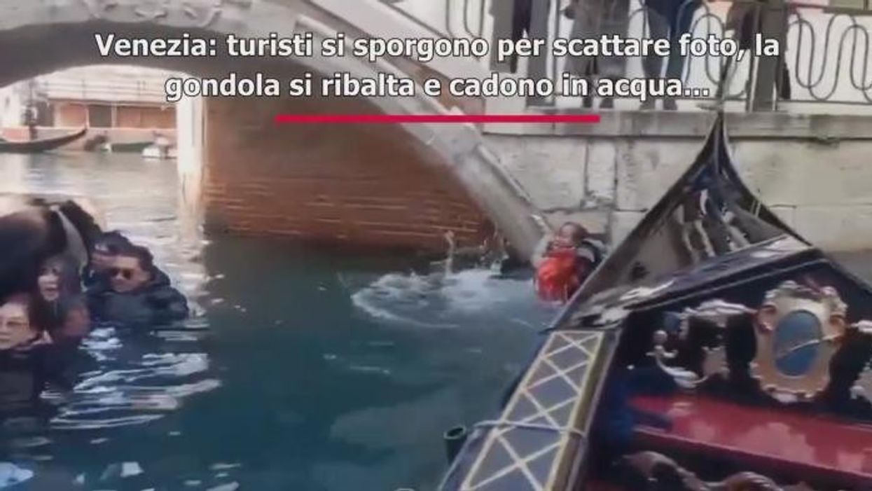 Selfie-taking tourists humiliated as they fall off gondola after being asked to 'sit down'