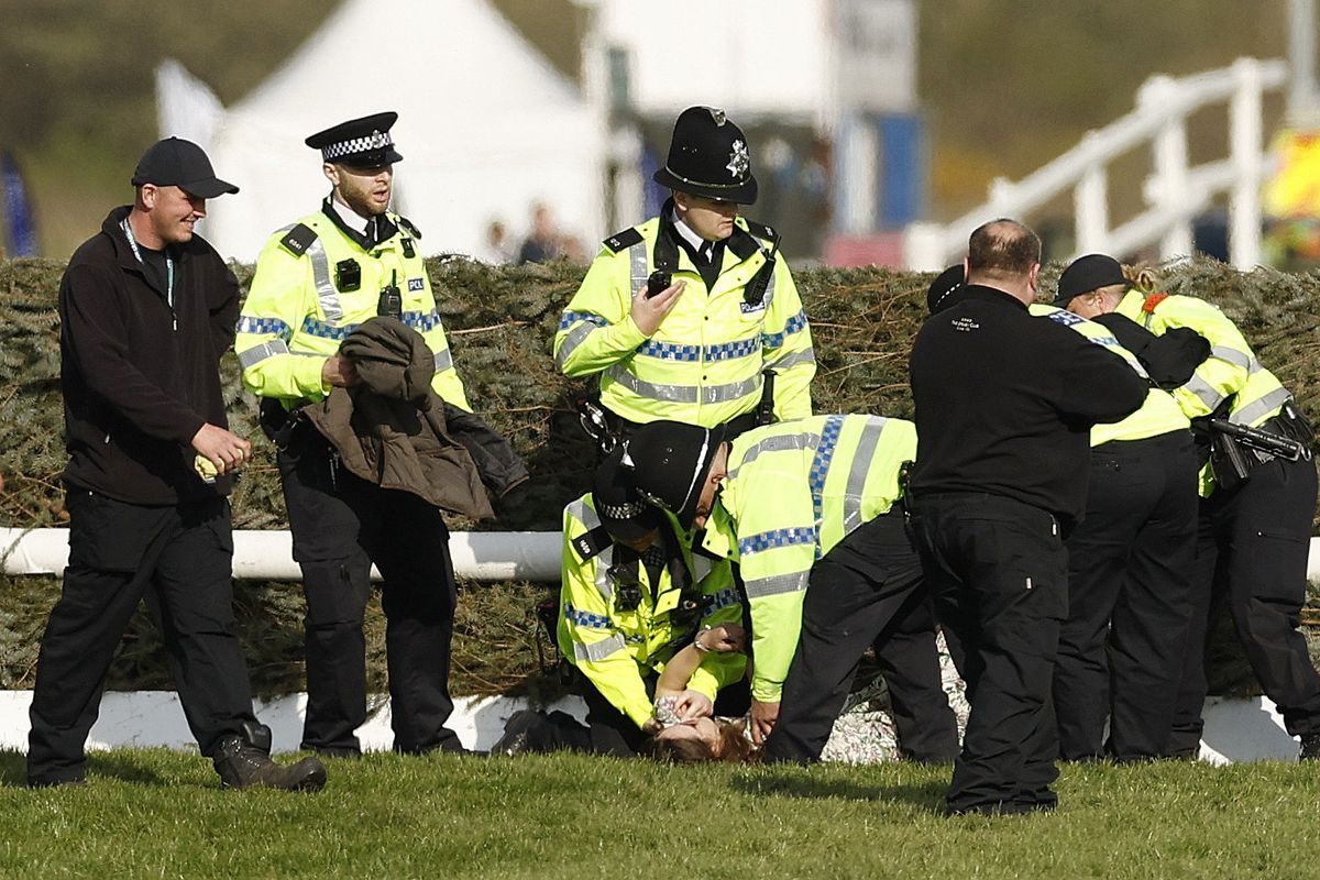 Grand National DELAYED as protesters storm Aintree course amid huge police presence
