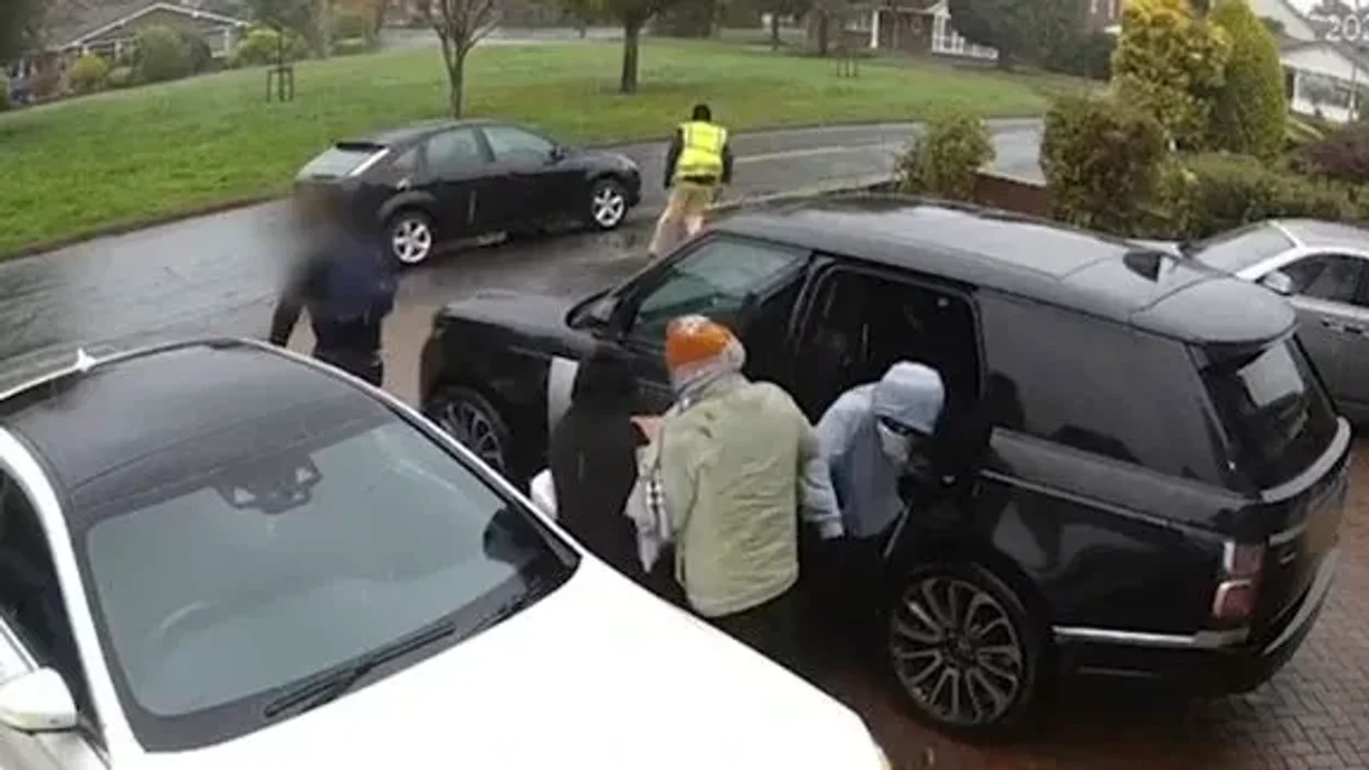 The group are seen getting into a Range Rover before fleeing on foot