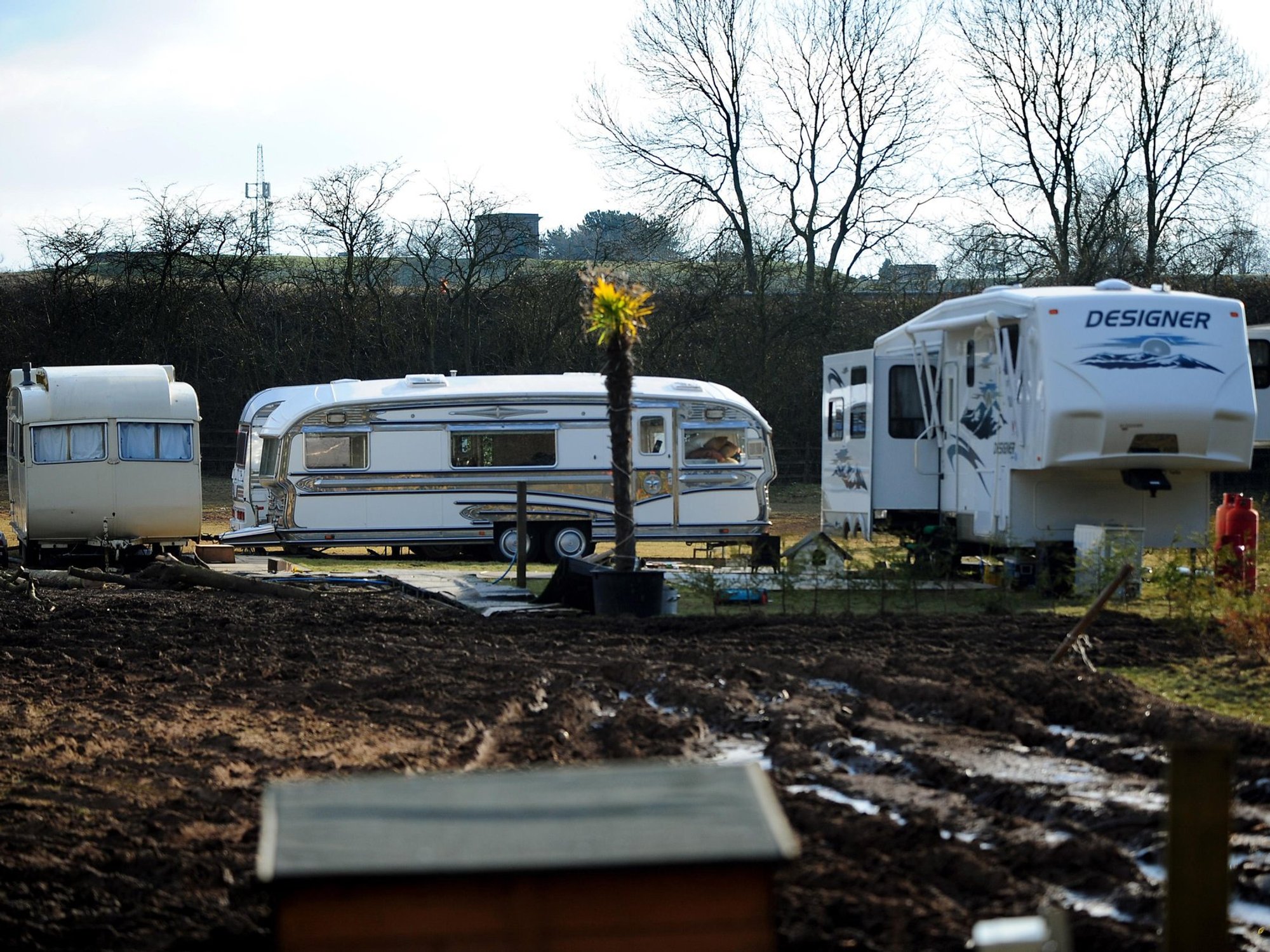 Neighbours demand travellers are jailed for turning quiet fields into sprawling caravan park