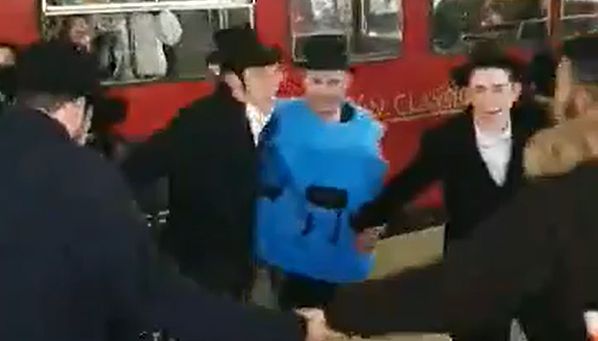 The group was spat at by a group of men in what was described as a 'bigoted antisemitic attack'.