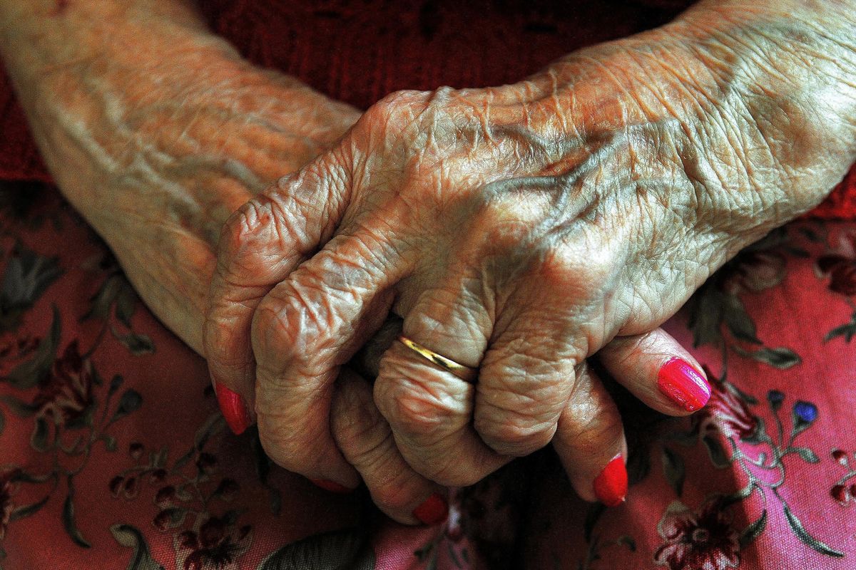 The hands of a resident at a nursing home