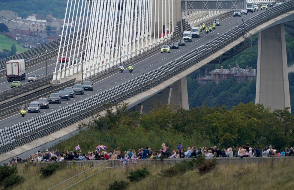 The hearse carrying the coffin of Queen Elizabeth II, draped with the Royal Standard of Scotland, passing over the Queensferry Crossing as it continues its journey to Edinburgh from Balmoral. Picture date: Sunday September 11, 2022.
