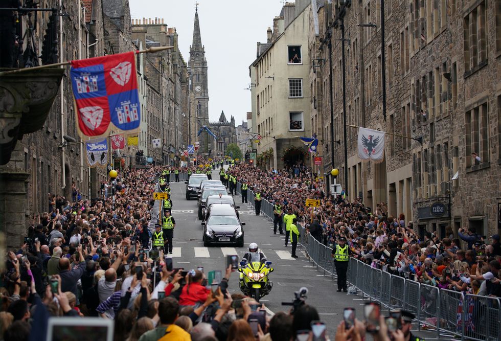 The hearse passes through the Royal Mile in Edinburgh.