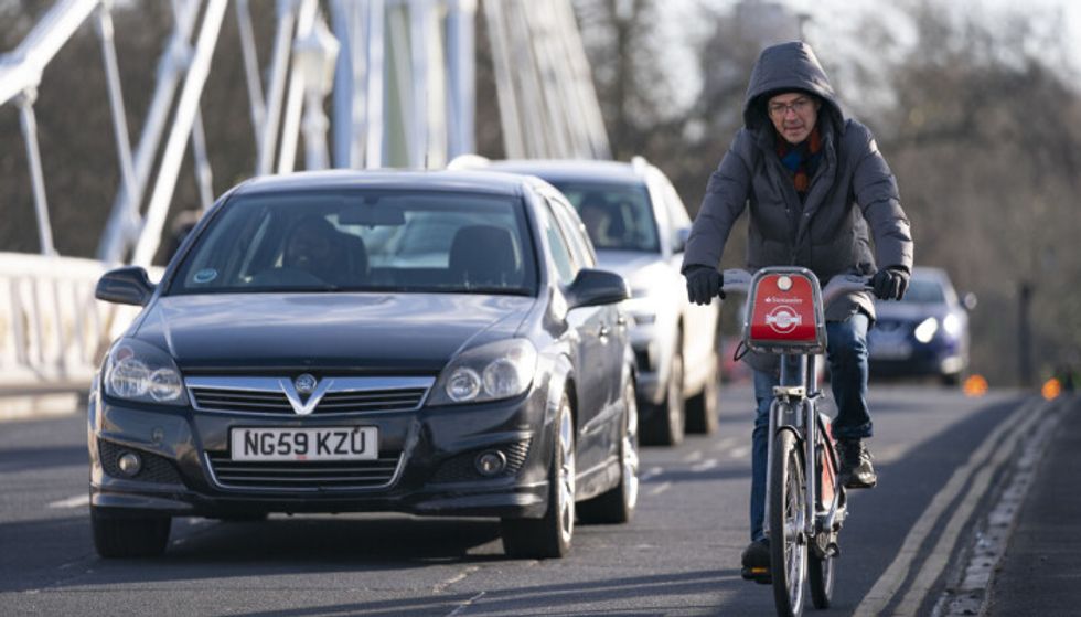 The Highway Code states: 'Drive or ride with both hands on the wheel or handlebars where possible'