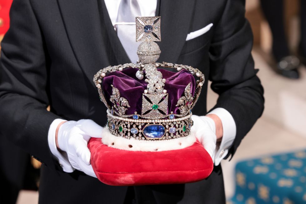 The Imperial State Crown arrives at the Sovereign's Entrance to the Palace of Westminster ahead of the State Opening of Parliament.