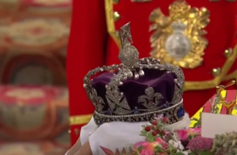 The Imperial State Crown, Orb and Sceptre, have been removed from the coffin and placed onto the altar of St George\u2019s Chapel by the Dean of Windsor