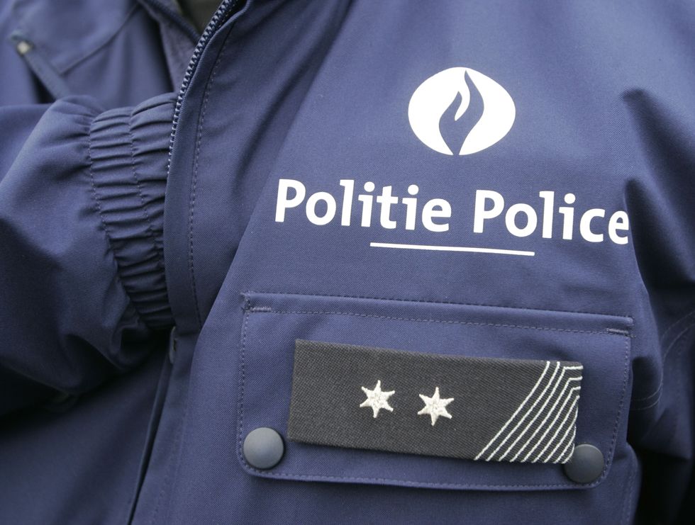 The logo on a police uniform is written in both French and Flemish