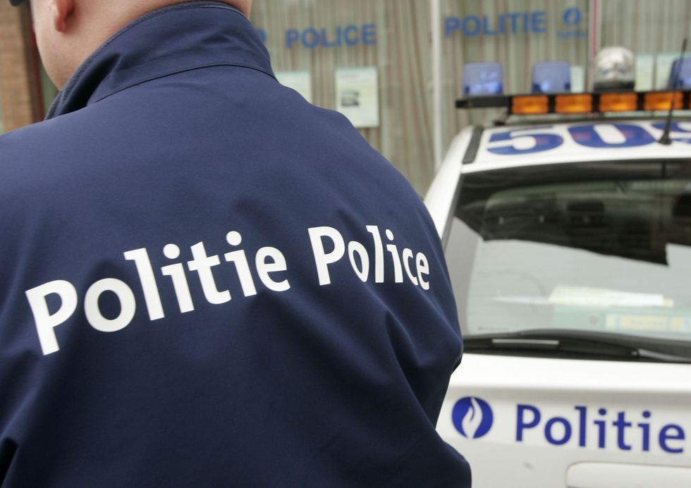 The logo on a police uniform is written in both French and Flemish