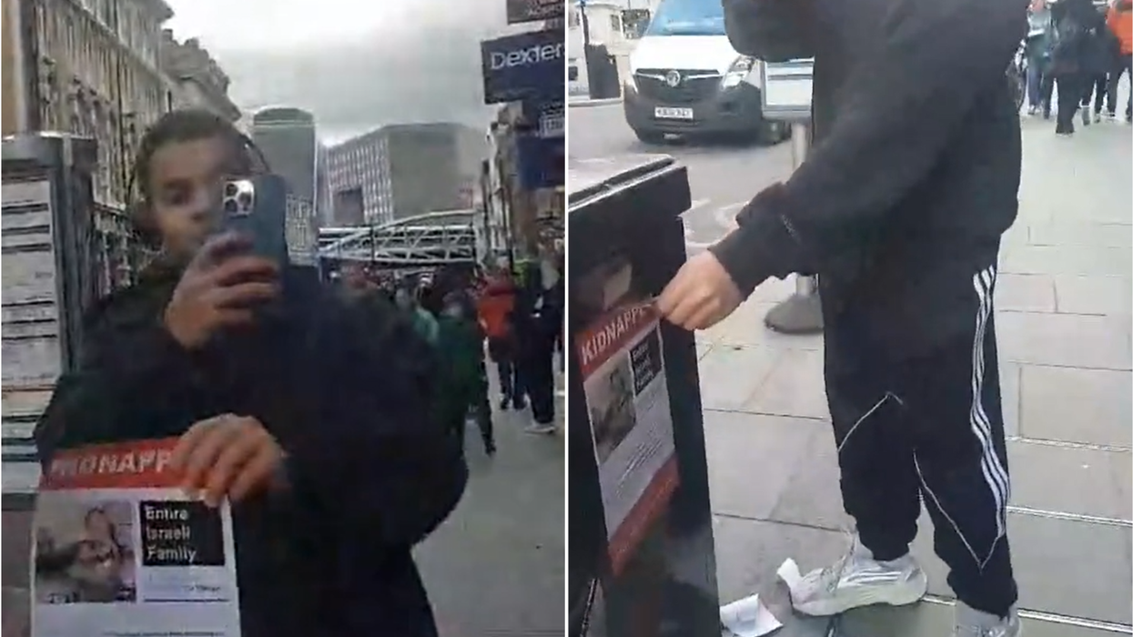 The man tearing down the posters