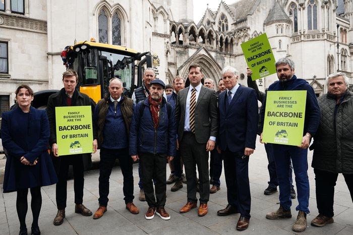 The Martins and the campaign group Farmers and Businesses for Fair Tax Relief outside the Royal Courts of Justice in central London
