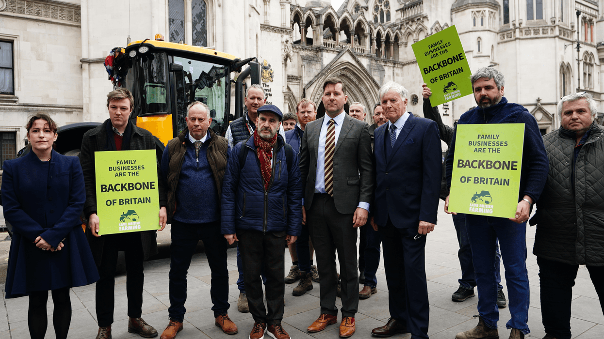 The Martins and the campaign group Farmers and Businesses for Fair Tax Relief outside the Royal Courts of Justice in central London