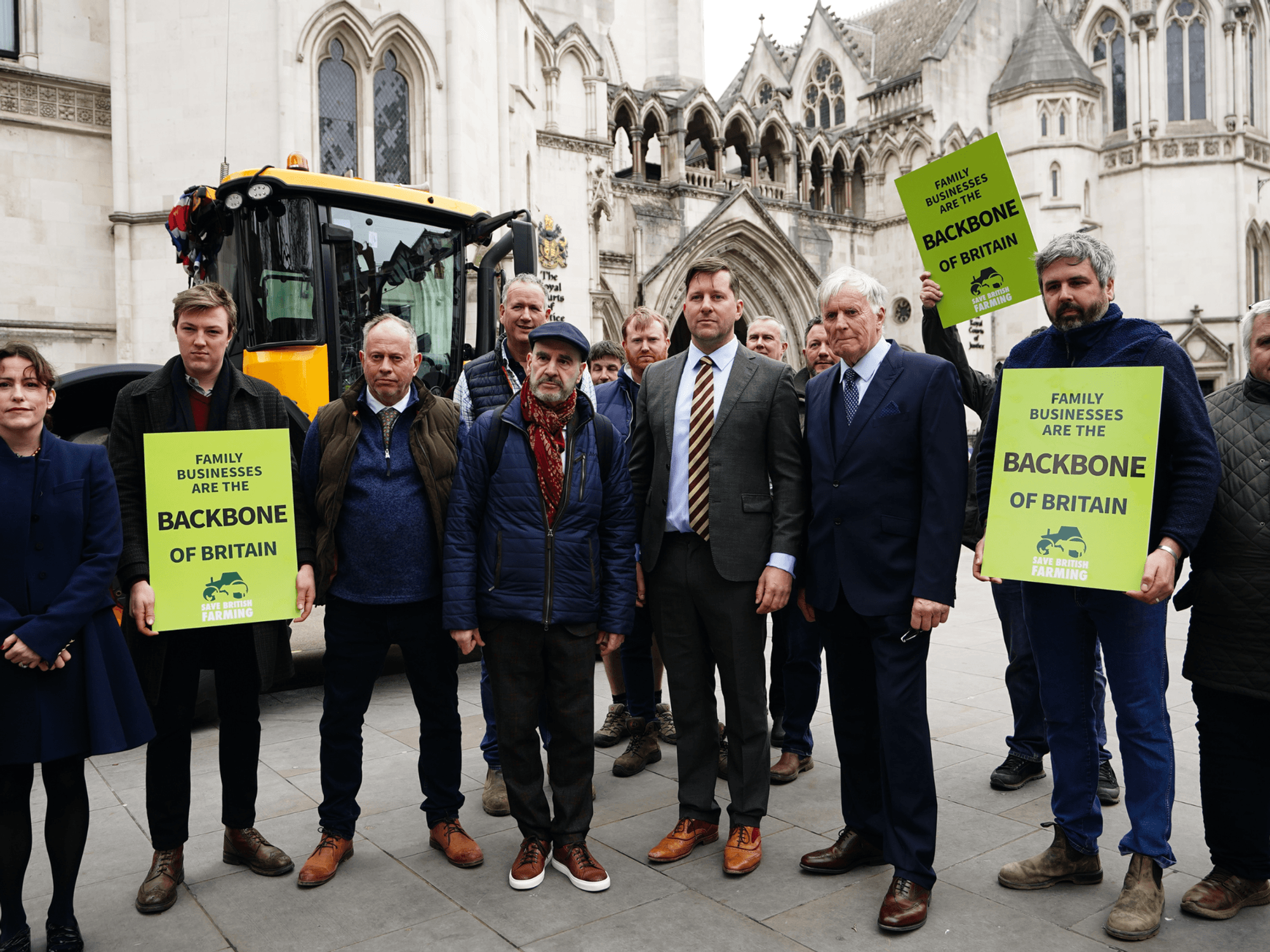 The Martins and the campaign group Farmers and Businesses for Fair Tax Relief outside the Royal Courts of Justice in central London