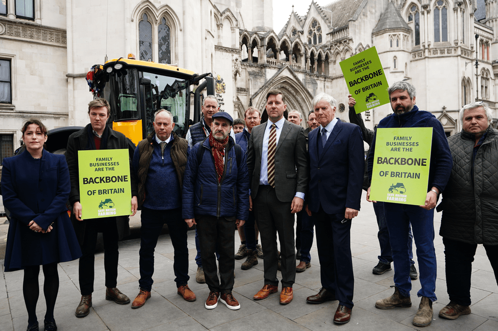 The Martins and the campaign group Farmers and Businesses for Fair Tax Relief outside the Royal Courts of Justice in central London