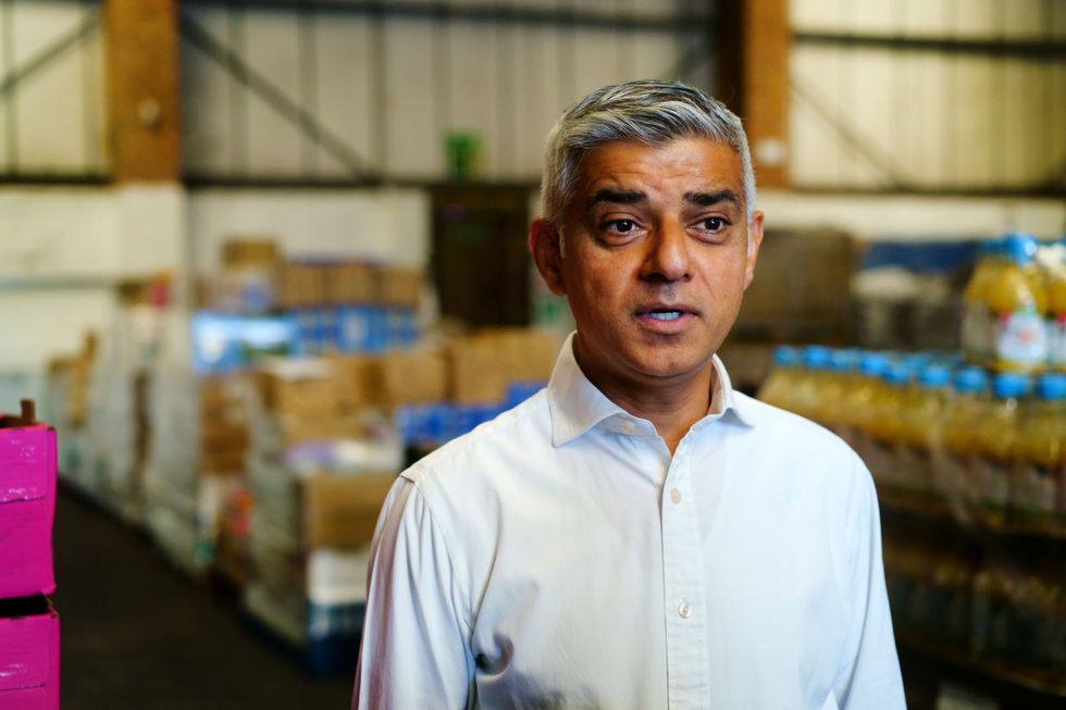 The Mayor of London, Sadiq Khan, talks to media during a visit to the Newham Food Alliance warehouse hub in North Woolwich. The hub, which is run by Newham council, collects food and then delivers it to foodbanks across the borough.Picture date: Friday August 12, 2022.