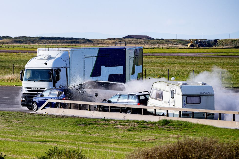 The moment of impact, remote controlled lorry and multiple cars collide as crash event goes to plan