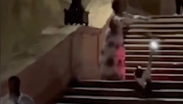 The moment the US tourist released the e-scooter down the historic marble steps