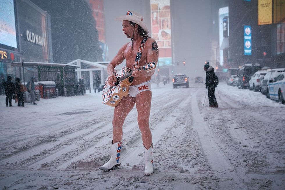 The Naked Cowboy performs under the snow in Times Square \u200b