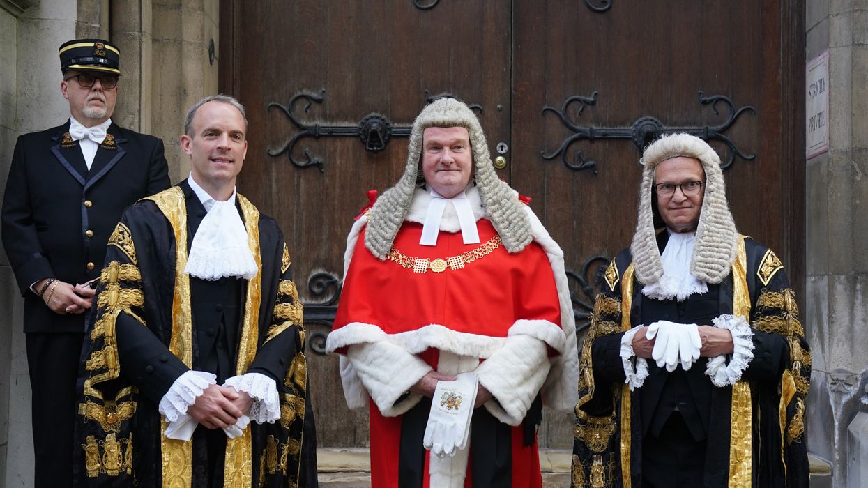 The new Lord Chancellor Dominic Raab (left) alongside Lord Chief Justice Lord Burnett (centre) and Master of the Rolls Sir Geoffrey Vos (right), at the Judge's entrance to the Royal Courts of Justice, in central London ahead of his swearing in ceremony as Lord Chancellor in 2021