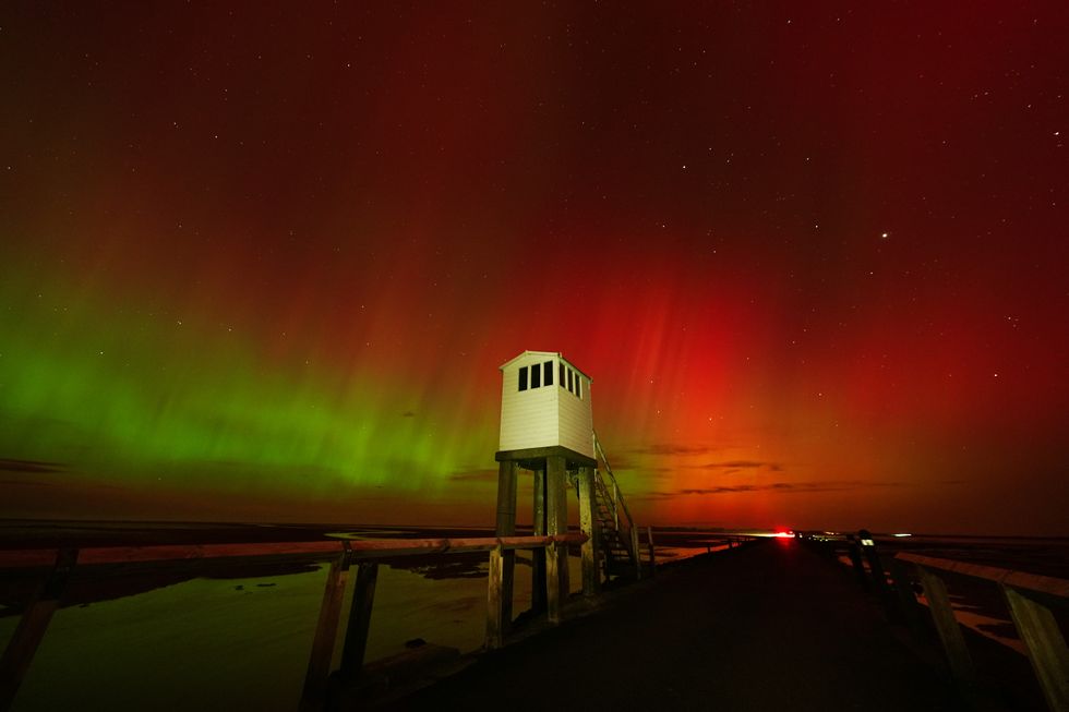 The Northern Lights, also known as the Aurora Borealis, seen in an incredible display in the skies over the refuge hut on the causeway leading to Holy Island in Northumberland\u200b